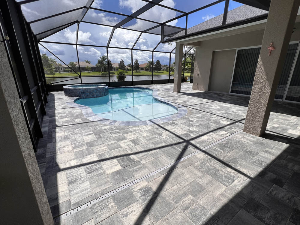 Paver pool deck that is now vibrant after receiving the best paver sealer and pressure washing service from Stellar Paver Sealing in Melbourne